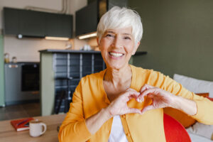 happy lady making heart with hands